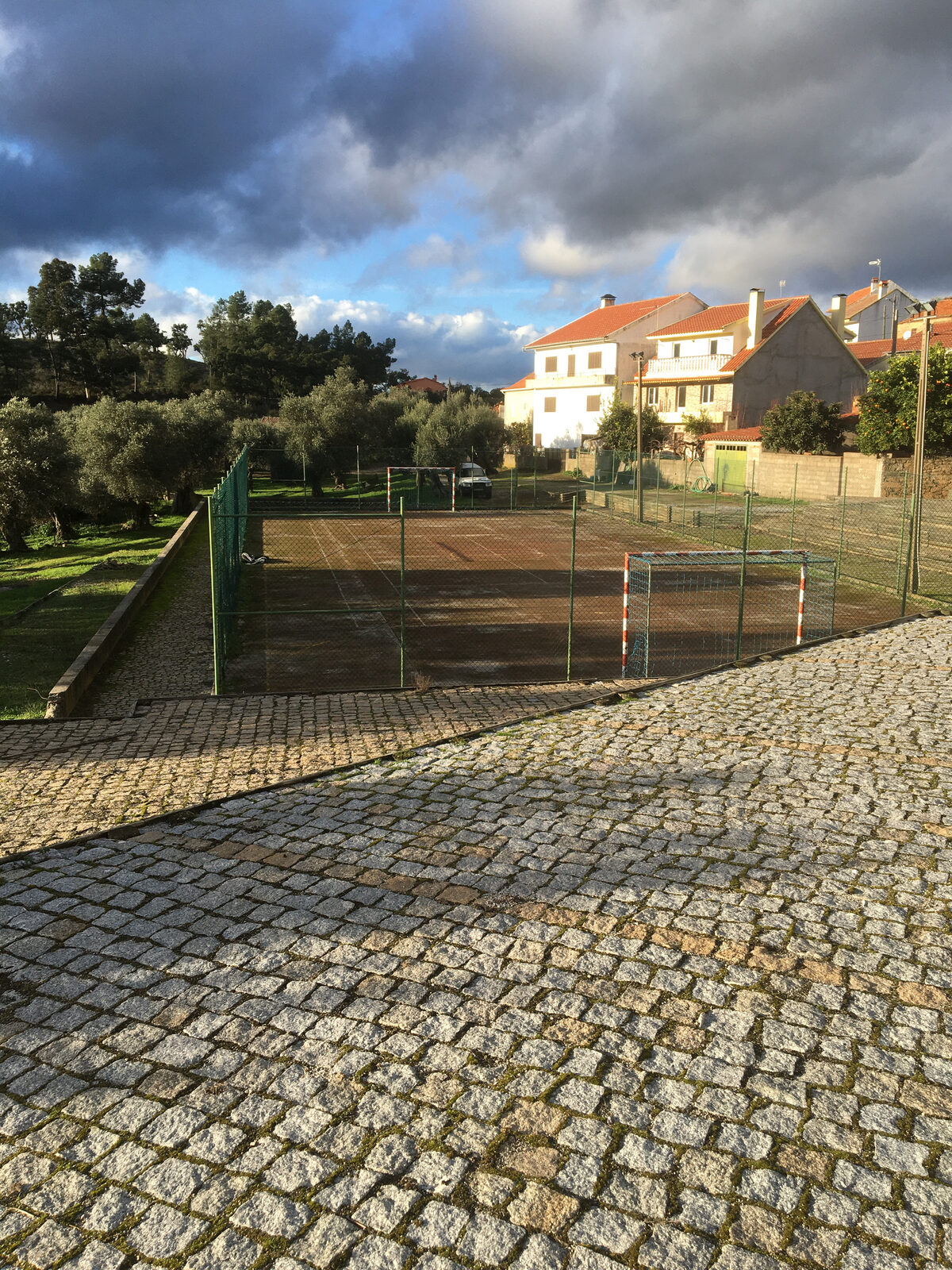 The sports pitch and village houses